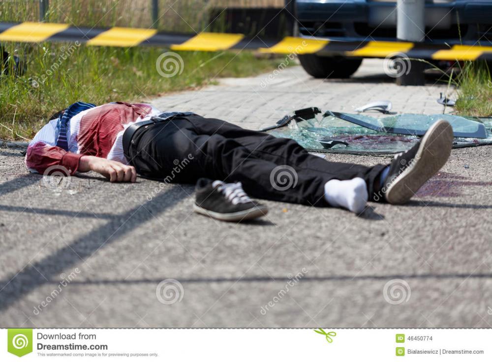 dead-casualty-car-crash-man-lying-road-46450774.jpg