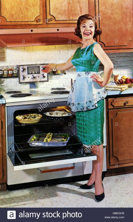 household-kitchen-and-kitchenware-woman-at-stove-in-front-of-open-GBEGCB.jpg